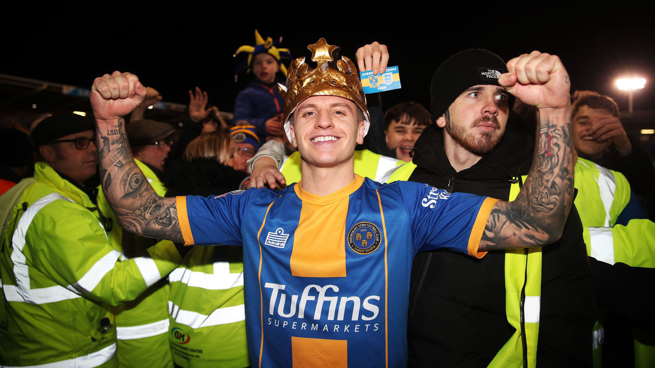 Shrewsbury Town's Jason Cummings at full time as fans invade the pitch after the FA Cup fourth round match at Montgomery Waters Meadow, Shrewsbury.