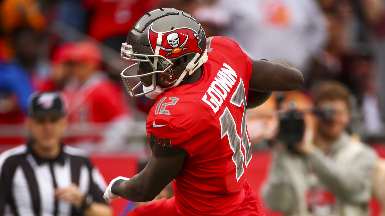 TAMPA, FLORIDA - NOVEMBER 17: Chris Godwin #12 of the Tampa Bay Buccaneers pushes his way into the end zone to score during the third quarter of the game against the New Orleans Saints on November 17, 2019 at Raymond James Stadium in Tampa, Florida.