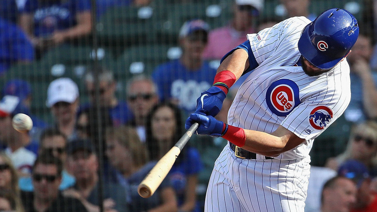 CHICAGO, ILLINOIS - AUGUST 30: Kyle Schwarber #12 of the Chicago Cubs hits a solo home run in the 8th inning against the Milwaukee Brewers at Wrigley Field on August 30, 2019 in Chicago, Illinois. The Cubs defeated the Brewers 7-1.
