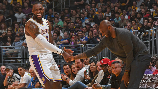 LOS ANGELES, CA - NOVEMBER 17: LeBron James #23 of the Los Angeles Lakers high fives NBA Legend, Kobe Bryant during the game against the Atlanta Hawks on November 17, 2019 at STAPLES Center in Los Angeles, California. NOTE TO USER: User expressly acknowledges and agrees that, by downloading and/or using this Photograph, user is consenting to the terms and conditions of the Getty Images License Agreement. Mandatory Copyright Notice: Copyright 2019 NBAE