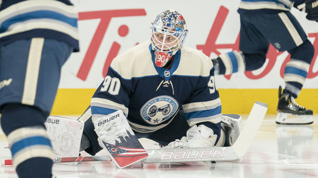 COLUMBUS, OH - JANUARY 22: Columbus Blue Jackets goaltender Elvis Merzlikins (90) stretching during warmups between the Columbus Blue Jackets and the Winnipeg Jets at Nationwide Arena in Columbus, Ohio on January 22, 2020.