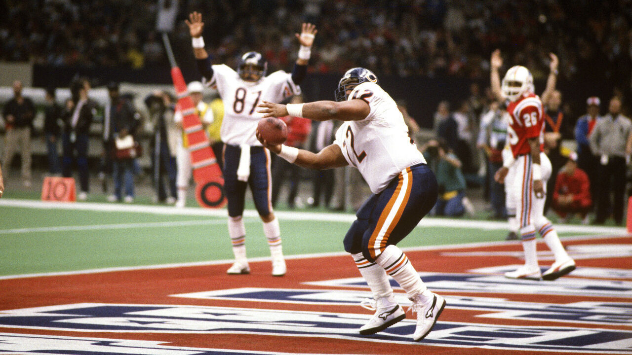 LOUISIANA, NO - JANUARY 26: William Perry #72 celebrates after scoring a touchdown against the New England Patriots during Superbowl XX at the Louisiana Superdome January 26, 1986 in New Orleans, Louisiana. The Bears won the Super Bowl 46-10.