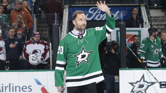 DALLAS, TX - JANUARY 13: Former Star Ed Belfour waves to the fans as he comes out to drop a ceremonial puck before a game between the Dallas Stars and the Colorado Avalanche at the American Airlines Center on January 13, 2018 in Dallas, Texas.