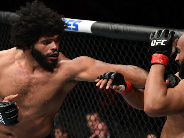 OTTAWA, ON - MAY 04: (L-R) Juan Adams punches Arjan Singh Bhullar of Canada in their heavyweight bout during the UFC Fight Night event at Canadian Tire Centre on May 4, 2019 in Ottawa, Ontario, Canada.