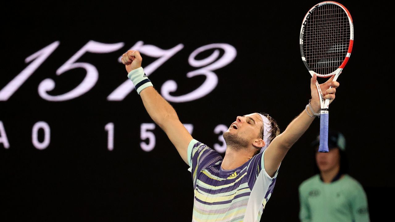 Austria's Dominic Thiem celebrates after victory against Spain's Rafael Nadal during their men's singles quarter-final match on day ten of the Australian Open tennis tournament in Melbourne on January 30, 2020.