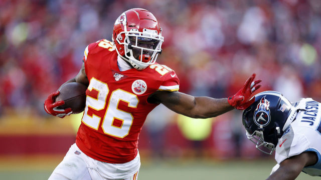 KANSAS CITY, MO - JANUARY 19: Damien Williams #26 of the Kansas City Chiefs runs with the ball during the AFC Championship game against the Tennessee Titans at Arrowhead Stadium on January 19, 2020 in Kansas City, Missouri. The Chiefs defeated the Titans 35-24.