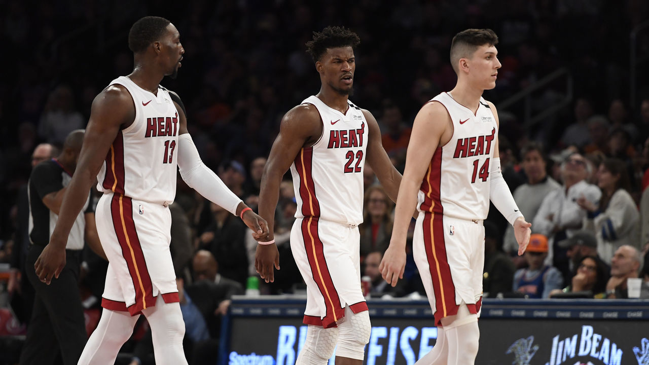 NEW YORK, NEW YORK - JANUARY 12: Bam Adebayo #13, Jimmy Butler #22, and Tyler Herro #14 of the Miami Heat look on during the second half of the game against the New York Knicks at Madison Square Garden on January 12, 2020 in New York City. The New York Knicks won 124-121.