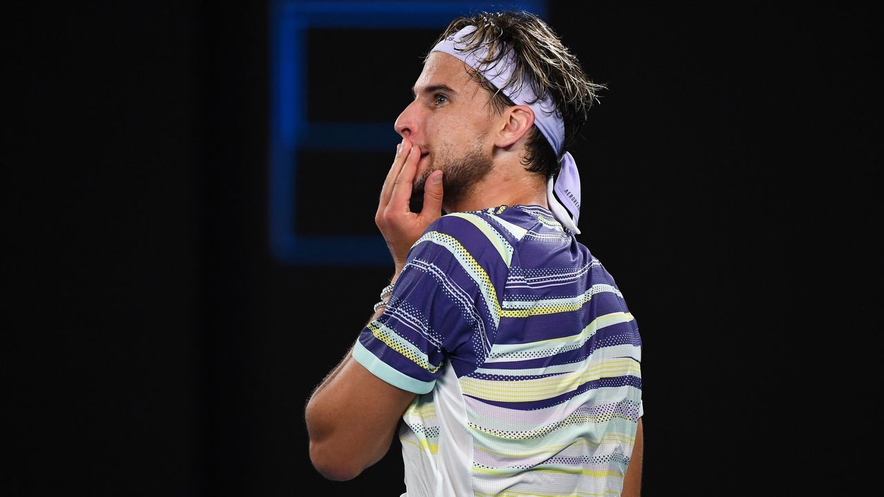 Austria's Dominic Thiem reacts after a point against Spain's Rafael Nadal during their men's singles quarter-final match on day ten of the Australian Open tennis tournament in Melbourne on January 29, 2020.