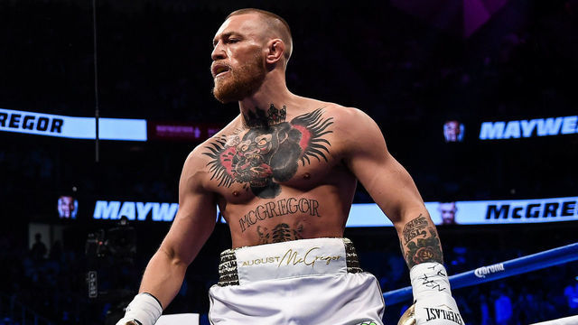 Nevada , United States - 26 August 2017; Conor McGregor, right, and Floyd Mayweather Jr during their super welterweight boxing match at T-Mobile Arena in Las Vegas, USA.