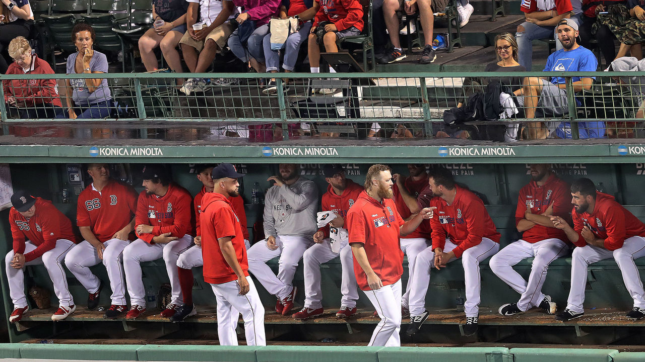 BOSTON - SEPTEMBER 4: Boston Red Sox reliever Andrew Cashner walks along the crowded Boston bullpen in the sixth inning. The Boston Red Sox host the Minnesota Twins in a regular season MLB baseball game at Fenway Park in Boston on Sep. 4, 2019.
