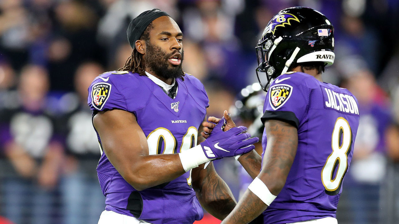 BALTIMORE, MARYLAND - JANUARY 11: Matthew Judon #99 greets Lamar Jackson #8 of the Baltimore Ravens before the AFC Divisional Playoff game against the Tennessee Titans at M&T Bank Stadium on January 11, 2020 in Baltimore, Maryland.