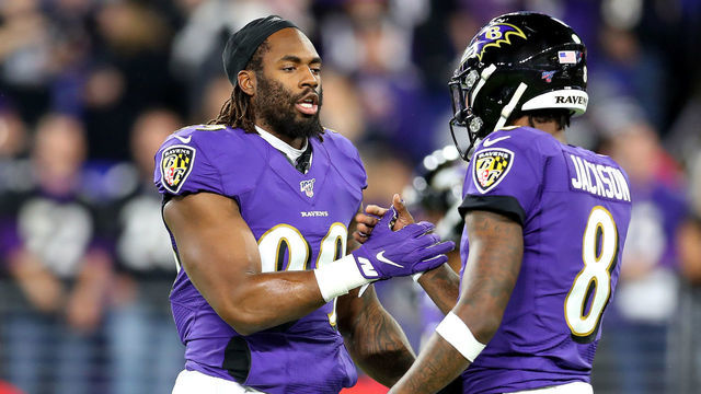 BALTIMORE, MARYLAND - JANUARY 11: Matthew Judon #99 greets Lamar Jackson #8 of the Baltimore Ravens before the AFC Divisional Playoff game against the Tennessee Titans at M&T Bank Stadium on January 11, 2020 in Baltimore, Maryland.