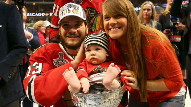 CHICAGO, IL - JUNE 15: Daniel Carcillo #13 of the Chicago Blackhawks and his family pose with the Stanley Cup after defeating the Tampa Bay Lightning by a score of 2-0 in Game Six to win the 2015 NHL Stanley Cup Final at the United Center on June 15, 2015 in Chicago, Illinois.