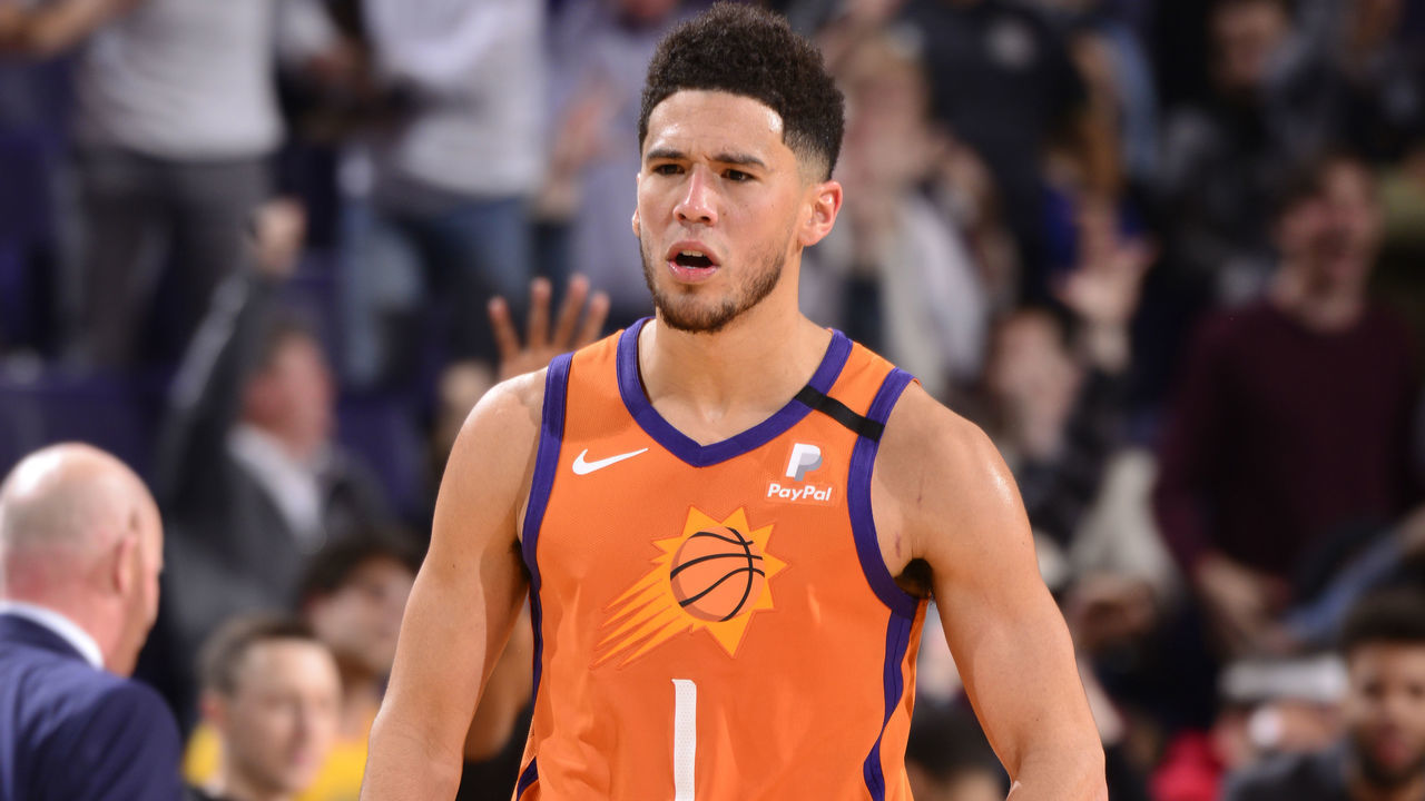PHOENIX, AZ - JANUARY 10: Devin Booker #1 of the Phoenix Suns reacts to play against the Orlando Magic on January 10, 2020 at Talking Stick Resort Arena in Phoenix, Arizona. Mandatory Copyright Notice: Copyright 2020 NBAE