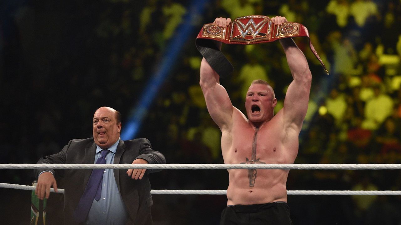 Brock Lesnar celebrates, with his manager Paul Heyman, after winning the WWE Universal Championship match as part of as part of the World Wrestling Entertainment (WWE) Crown Jewel pay-per-view at the King Saud University Stadium in Riyadh on November 2, 2018.