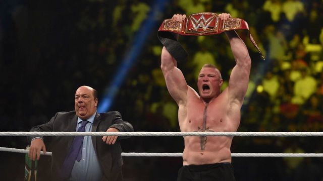 Brock Lesnar celebrates, with his manager Paul Heyman, after winning the WWE Universal Championship match as part of as part of the World Wrestling Entertainment (WWE) Crown Jewel pay-per-view at the King Saud University Stadium in Riyadh on November 2, 2018.