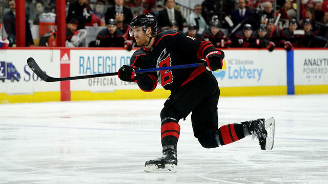 RALEIGH, NC - DECEMBER 31: Dougie Hamilton #19 of the Carolina Hurricanes shoots the puck during an NHL game against the Montreal Canadiens on December 31, 2019 at PNC Arena in Raleigh, North Carolina.