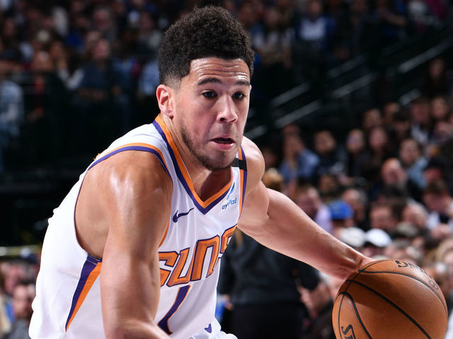 DALLAS, TX - JANUARY 28: Devin Booker #1 of the Phoenix Suns drives to the basket against the Dallas Mavericks on January 28, 2020 at the American Airlines Center in Dallas, Texas. Mandatory Copyright Notice: Copyright 2020 NBAE