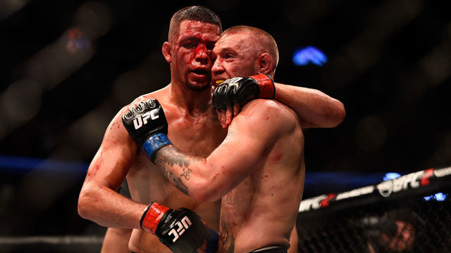 LAS VEGAS, NV - AUGUST 20: (L-R) Nate Diaz and Conor McGregor of Ireland embrace after finishing five rounds in their welterweight bout during the UFC 202 event at T-Mobile Arena on August 20, 2016 in Las Vegas, Nevada.