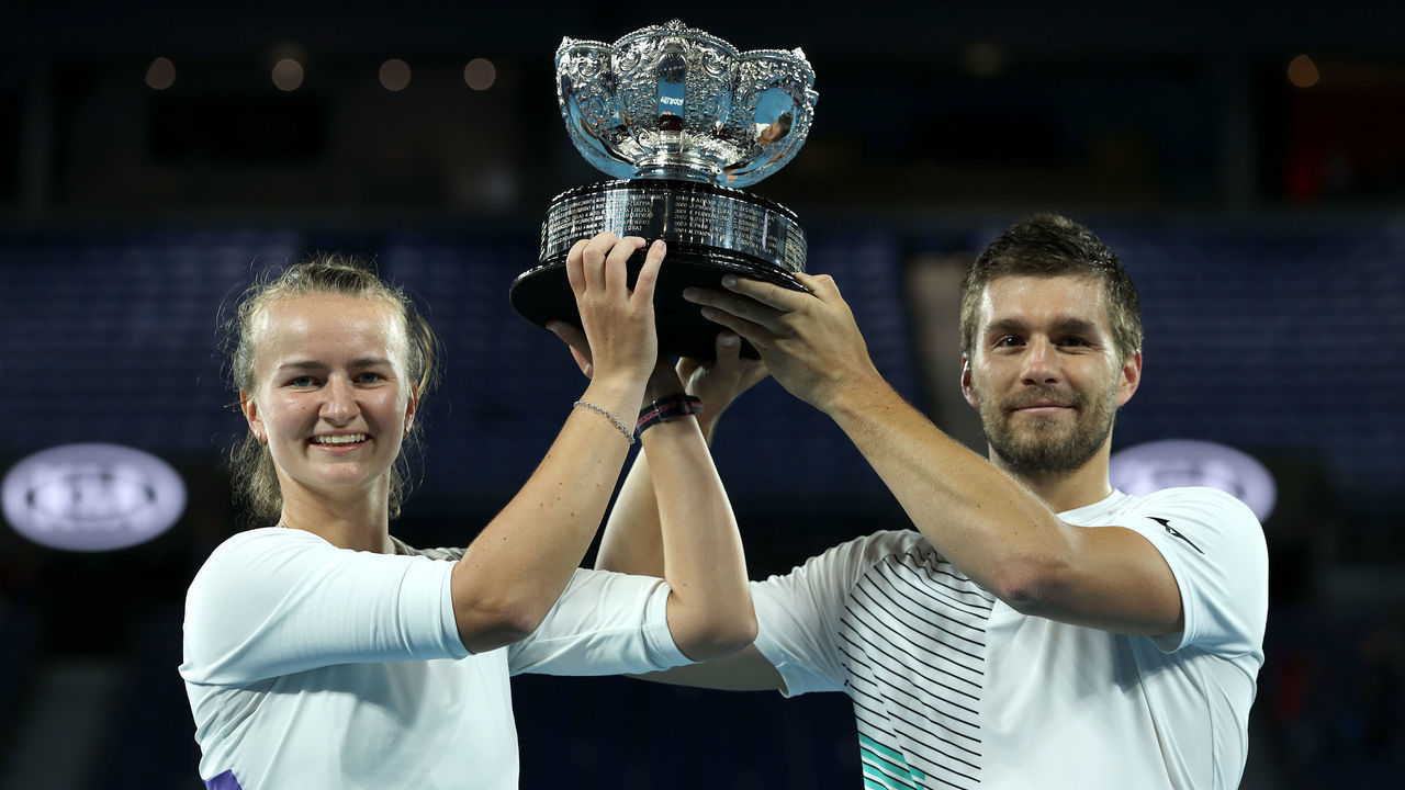 MELBOURNE, AUSTRALIA - FEBRUARY 01: Barbora Krejcikova of Czech Republic and Nikola Mektic of Croatia pose with the championship trophy after winning their Mixed Doubles Finals match against Bethanie Mattek-Sands of the United States and Jamie Murray of Great Britain on day thirteen of the 2020 Australian Open at Melbourne Park on February 01, 2020 in Melbourne, Australia.