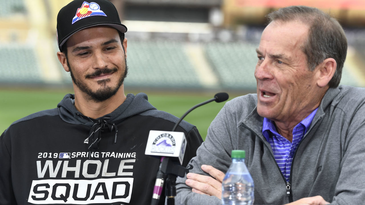 SCOTTSDALE, AZ - FEBRUARY 27: Colorado Rockies third baseman Nolan Arenado (28) smiles listening to Rockies owner Dick Monfort at Salt River Fields February 27, 2019. The Colorado Rockies and Arenado signed a 8-year, $260 million dollar deal, largest in franchise history, with a opt-out clause after three years.