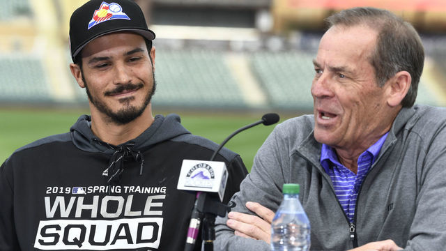 SCOTTSDALE, AZ - FEBRUARY 27: Colorado Rockies third baseman Nolan Arenado (28) smiles listening to Rockies owner Dick Monfort at Salt River Fields February 27, 2019. The Colorado Rockies and Arenado signed a 8-year, $260 million dollar deal, largest in franchise history, with a opt-out clause after three years.