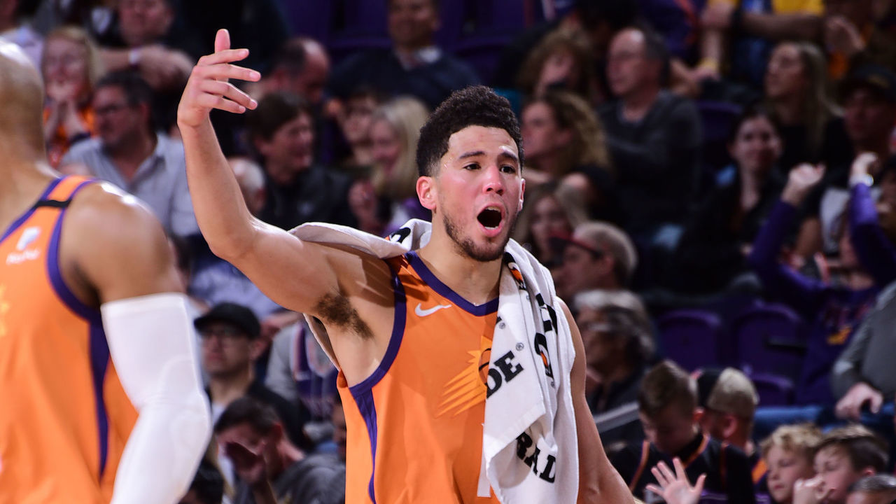 PHOENIX, AZ - JANUARY 31: Devin Booker #1 of the Phoenix Suns hypes up the crowd during the game against the Oklahoma City Thunder on January 31, 2020 at Talking Stick Resort Arena in Phoenix, Arizona. Mandatory Copyright Notice: Copyright 2020 NBAE