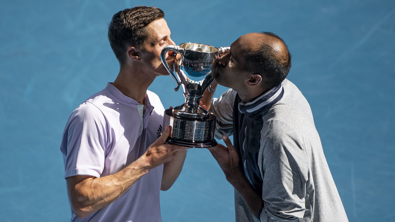 MELBOURNE, AUSTRALIA - FEBRUARY 02: Joe Salisbury of Great Britain and Rajeev Ram of the United States celebrate with the trophy after winning the men's doubles final against Luke Saville and Max Purcell of Australia on day fourteen of the 2020 Australian Open at Melbourne Park on February 02, 2020 in Melbourne, Australia.