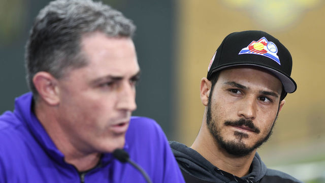 SCOTTSDALE, AZ - FEBRUARY 27: Colorado Rockies third baseman Nolan Arenado (28) listens to GM Jeff Bridich during his press conference at Salt River Fields February 27, 2019. The Colorado Rockies and Arenado signed a 8-year, $260 million dollar deal, largest in franchise history, with a opt-out clause after three years.