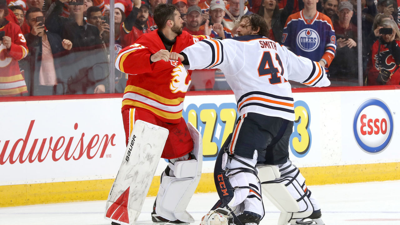 CALGARY, ALBERTA -FEBRUARY 01: Cam Talbot #39 of the Calgary Flames fights Mike Smith #41 of the Edmonton Oilers at Scotiabank Saddledome on February 01, 2020 in Calgary, Canada.