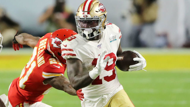 MIAMI, FLORIDA - FEBRUARY 02: Deebo Samuel #19 of the San Francisco 49ers rushes the ball against Raheem Mostert #31 of the San Francisco 49ers in Super Bowl LIV at Hard Rock Stadium on February 02, 2020 in Miami, Florida.
