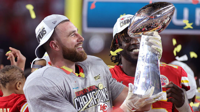 MIAMI, FLORIDA - FEBRUARY 02: Travis Kelce #87 of the Kansas City Chiefs raises the Vince Lombardi Trophy after defeating the San Francisco 49ers 31-20 in Super Bowl LIV at Hard Rock Stadium on February 02, 2020 in Miami, Florida.