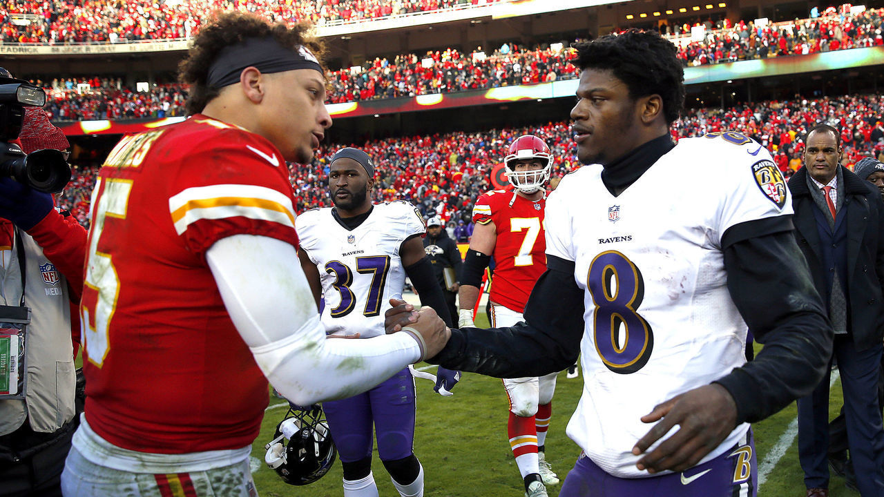 KANSAS CITY, MISSOURI - DECEMBER 09: Quarterback Patrick Mahomes #15 of the Kansas City Chiefs shakes hands with quarterback Lamar Jackson #8 of the Baltimore Ravens after the Chiefs defeated the Ravens 27-24 in overtime to win the game at Arrowhead Stadium on December 09, 2018 in Kansas City, Missouri.