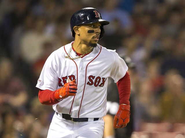 BOSTON - SEPTEMBER 8: Boston Red Sox right fielder Mookie Betts (50) runs to first base during the bottom of the first inning. The Boston Red Sox host the New York Yankees in a regular season MLB baseball game at Fenway Park in Boston on Sep. 8, 2019.