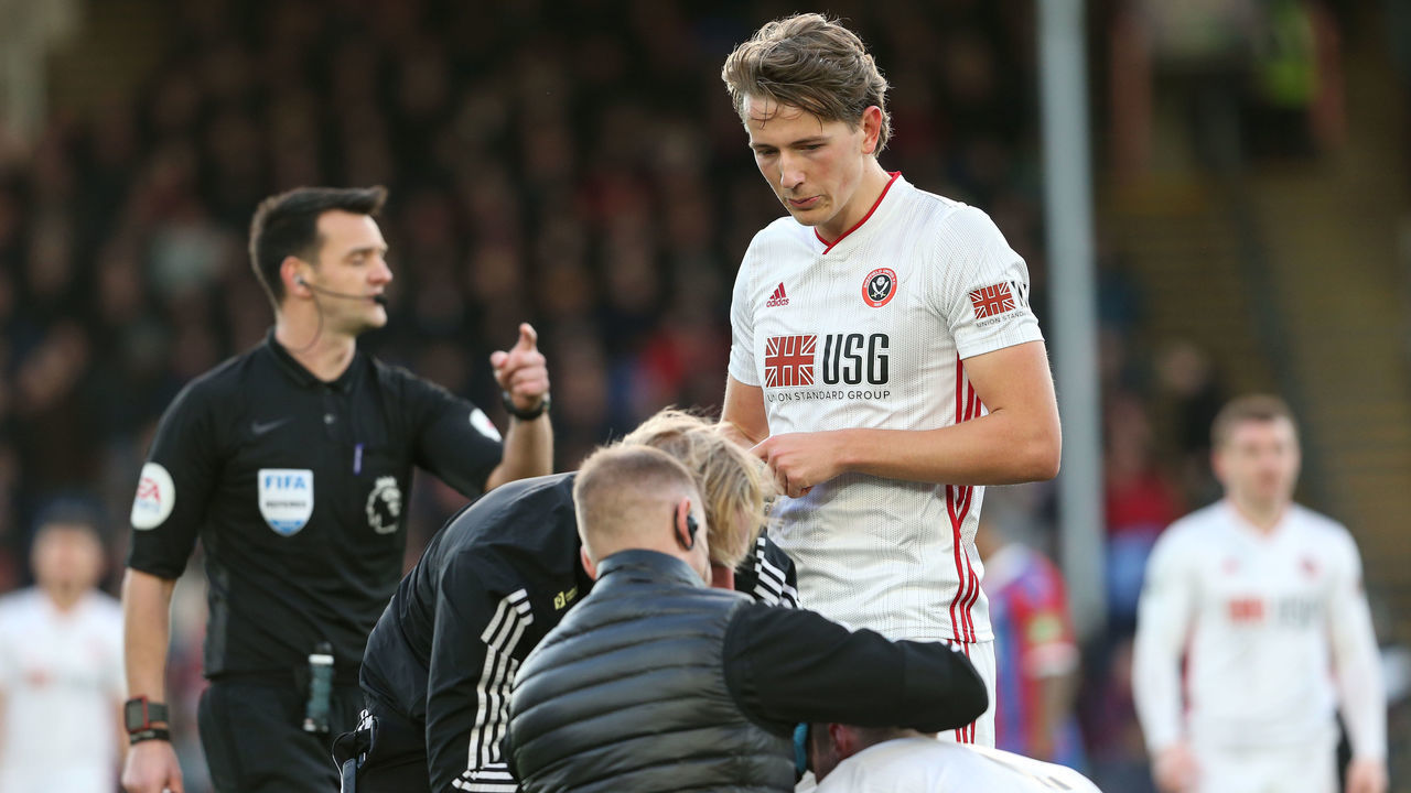 LONDON, ENGLAND - FEBRUARY 01: Sander Berge of Sheffield United watches as Chris Basham has his head bandaged during the Premier League match between Crystal Palace and Sheffield United at Selhurst Park on February 1, 2020 in London, United Kingdom.