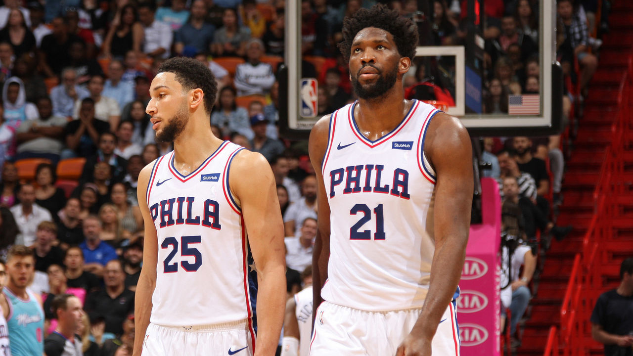 MIAMI, FL - DECEMBER 28: Ben Simmons #25 of the Philadelphia 76ers and Joel Embiid #21 of the Philadelphia 76ers looks on during the game against the Miami Heat on December 28, 2019 at American Airlines Arena in Miami, Florida. Mandatory Copyright Notice: Copyright 2020 NBAE