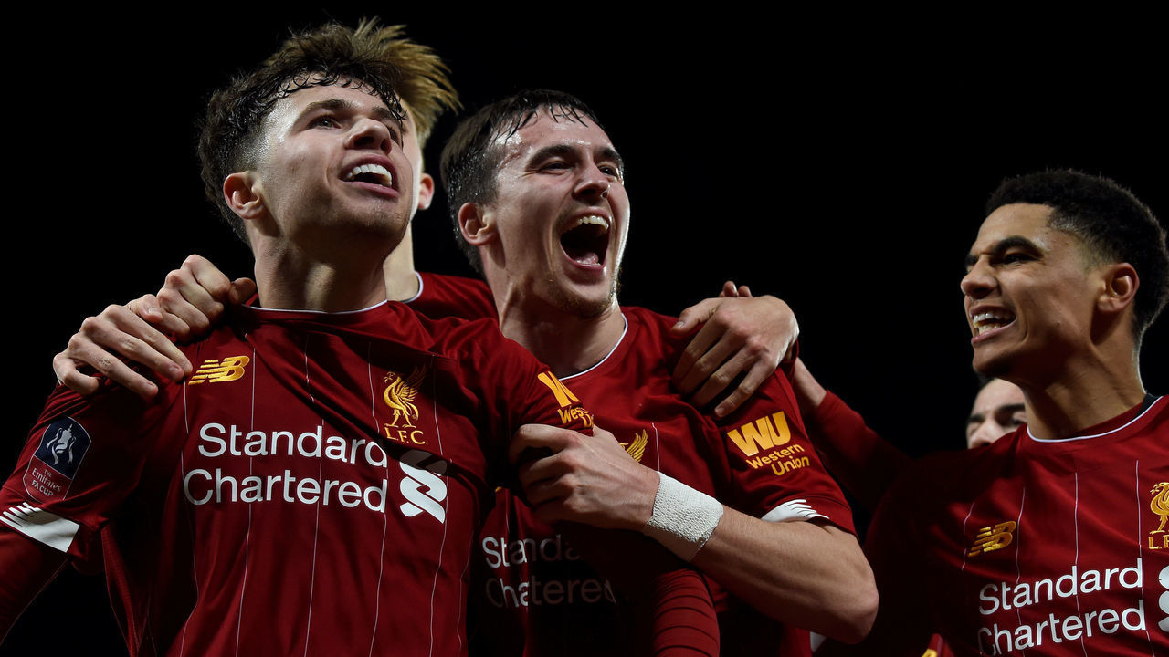 LIVERPOOL, ENGLAND - FEBRUARY 04: (THE SUN OUT, THE SUN ON SUNDAY OUT) Liam Millar of Liverpool and Neco Williams of Liverpool with Ki-Jana Hoever of Liverpool celebrates after the opening goal during the FA Cup Fourth Round Replay match between Liverpool FC and Shrewsbury Town at Anfield on February 04, 2020 in Liverpool, England.