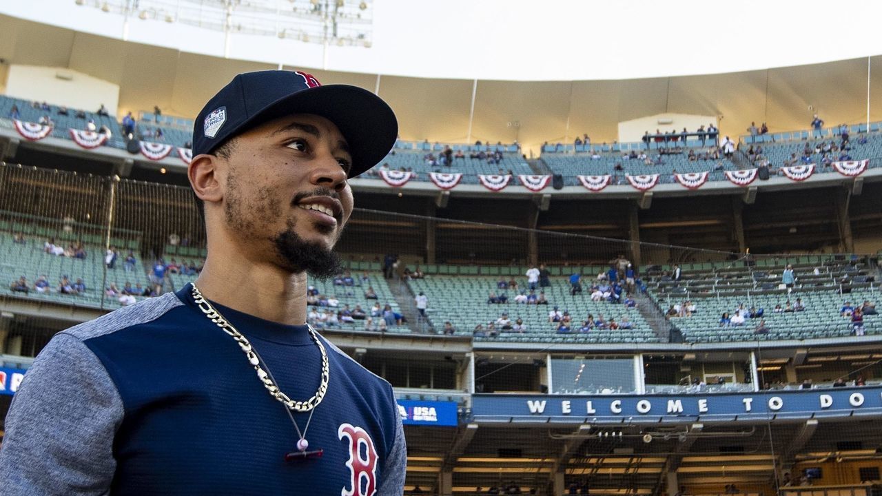 LOS ANGELES, CA - OCTOBER 26: Mookie Betts #50 of the Boston Red Sox looks on before game three of the 2018 World Series against the Los Angeles Dodgers on October 26, 2018 at Dodger Stadium in Los Angeles, California.