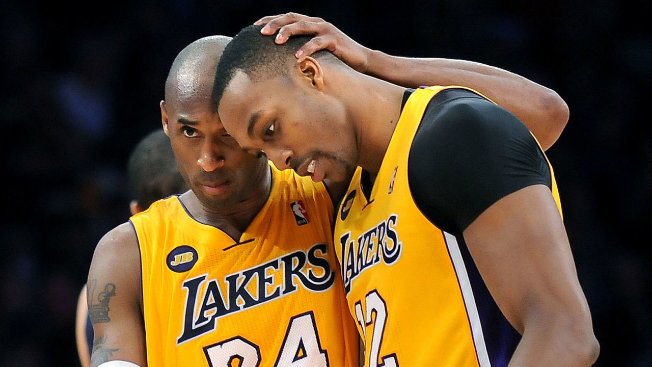 Lakers Kobe Bryant hugs Dwight Howard after Howard made one of two free throws with 4.1 seconds left in the game against the Grizzlies at the Staples Center Friday.