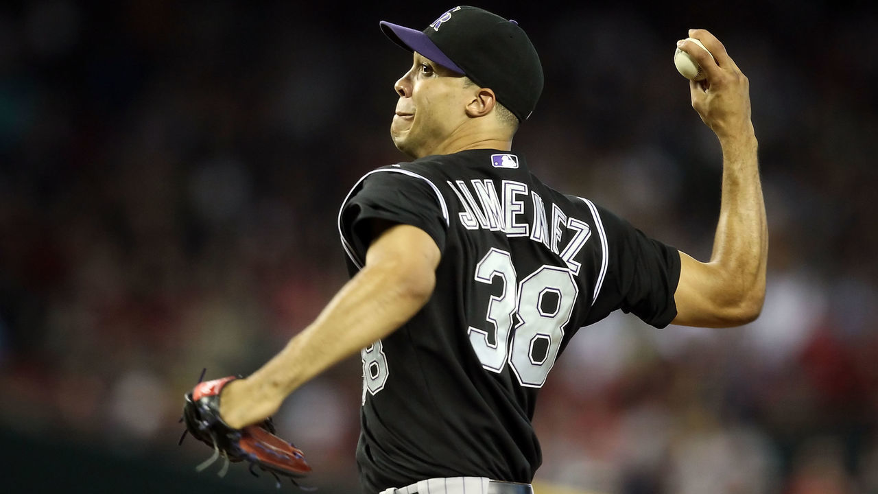 PHOENIX, AZ - JULY 24: Starting pitcher Ubaldo Jimenez #38 of the Colorado Rockies pitches against the Arizona Diamondbacks during the Major League Baseball game at Chase Field on July 24, 2011 in Phoenix, Arizona. The Diamondbacks defeated the Rockies 7-0.