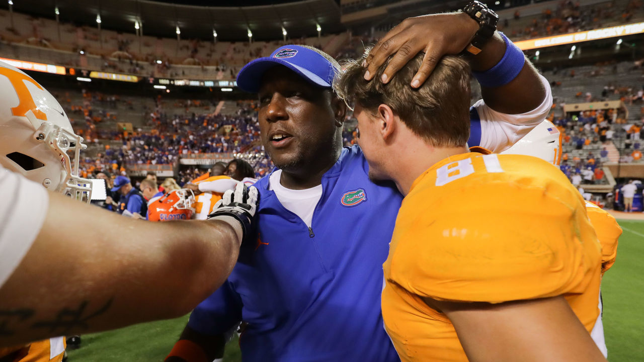 KNOXVILLE, TN - SEPTEMBER 22: Larry Scott of the Florida Gators hugs former player tight end Austin Pope #81 of the Tennessee Volunteers after the game between the Florida Gators and Tennessee Volunteers at Neyland Stadium on September 22, 2018 in Knoxville, Tennessee. Florida won the game 47-21.