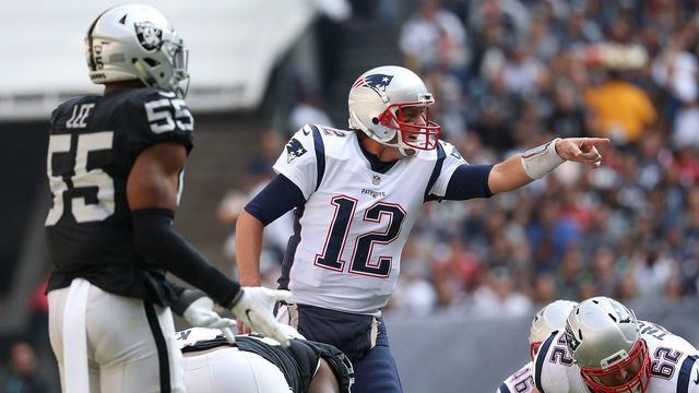 MEXICO CITY, MEXICO - NOVEMBER 19: Tom Brady #12 of the New England Patriots directs the offense against the Oakland Raiders during the first half at Estadio Azteca on November 19, 2017 in Mexico City, Mexico.