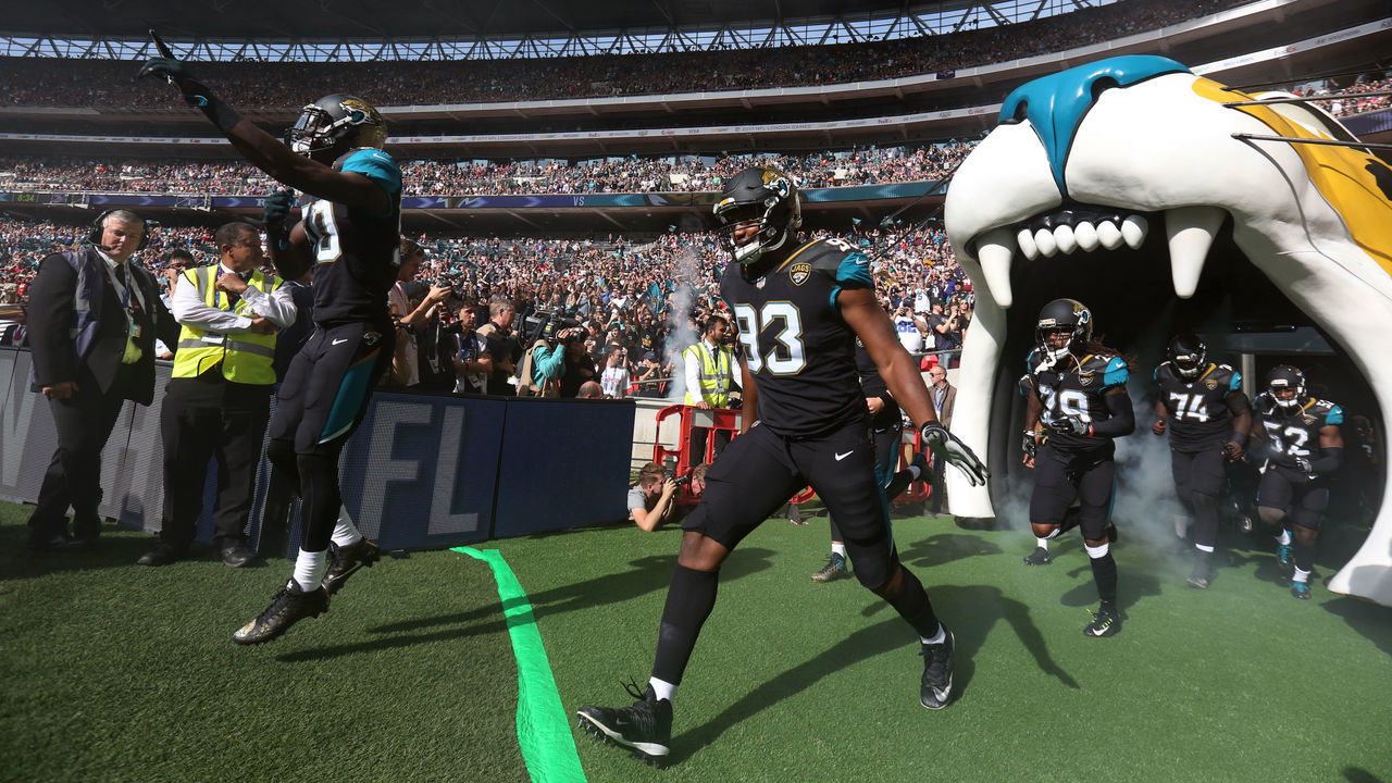 Jacksonville Jaguars players run out for the start of the NFL International Series match at Wembley Stadium, London.
