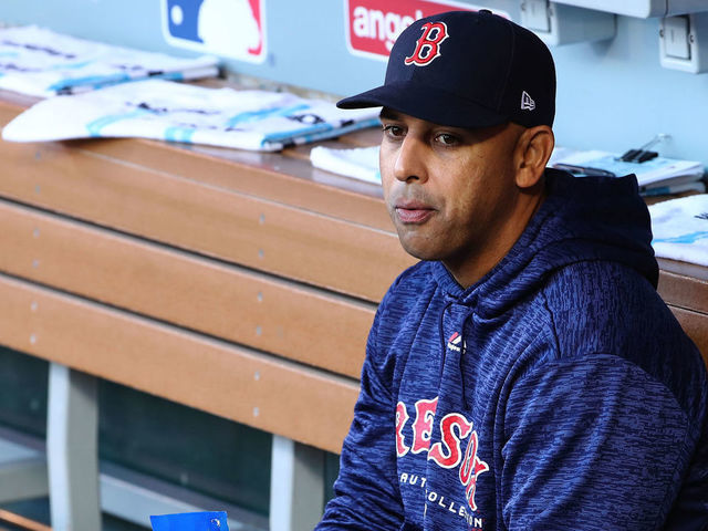 ANAHEIM, CA - APRIL 19: Manager Alex Cora #20 of the Boston Red Sox sits in the dugout prior to the MLB game against the Los Angeles Angels of Anaheim at Angel Stadium on April 19, 2018 in Anaheim, California. The Red Sox defeated the Angels 8-2.
