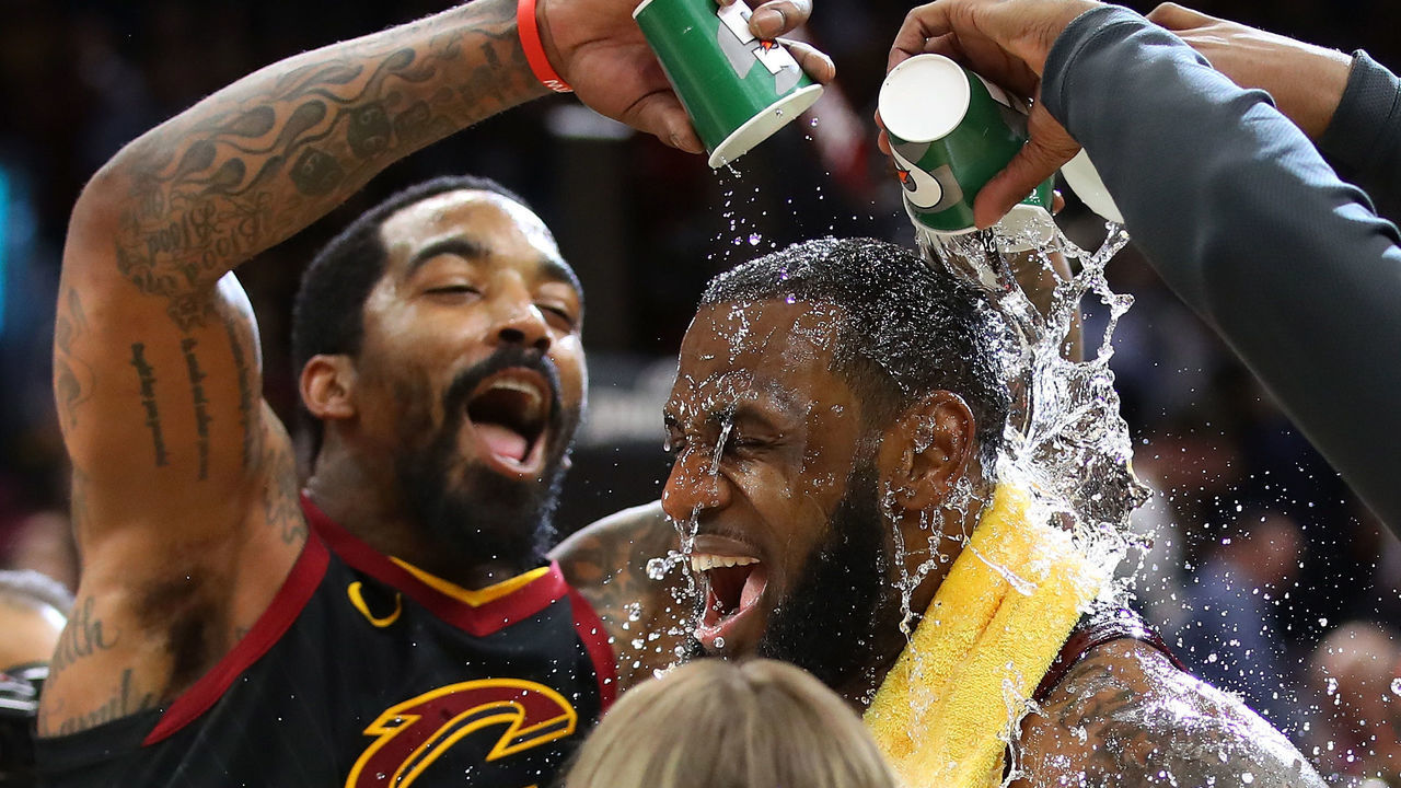 CLEVELAND, OH - APRIL 25: LeBron James #23 of the Cleveland Cavaliers is showered with water by JR Smith #5 while being interviewed after a 98-95 win over the Indiana Pacers in Game Five of the Eastern Conference Quarterfinals during the 2018 NBA Playoffs at Quicken Loans Arena on April 25, 2018 in Cleveland, Ohio.