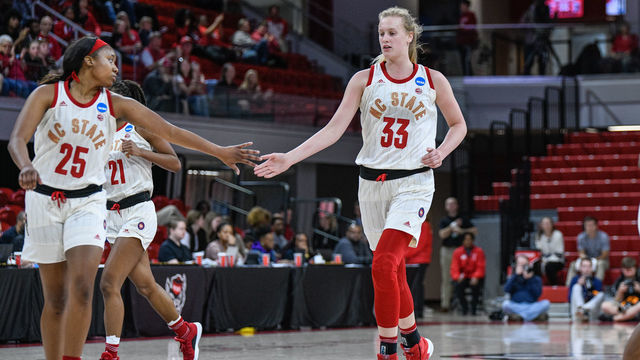 RALEIGH, NC - MARCH 23: NC State Wolfpack center Elissa Cunane (33) and NC State Wolfpack forward Kayla Jones (25) celebrate after the bucket during the 2019 Div 1 Women's Championship - First Round college basketball game between the Maine Black Bears and NC State Wolfpack on March 23, 2019, at Reynolds Coliseum in Raleigh, NC.