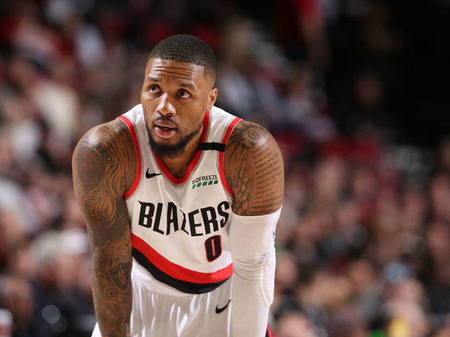 PORTLAND, OR - FEBRUARY 6: Damian Lillard #0 of the Portland Trail Blazers looks on during a game against the San Antonio Spurs on February 6, 2020 at the Moda Center Arena in Portland, Oregon. Mandatory Copyright Notice: Copyright 2020 NBAE