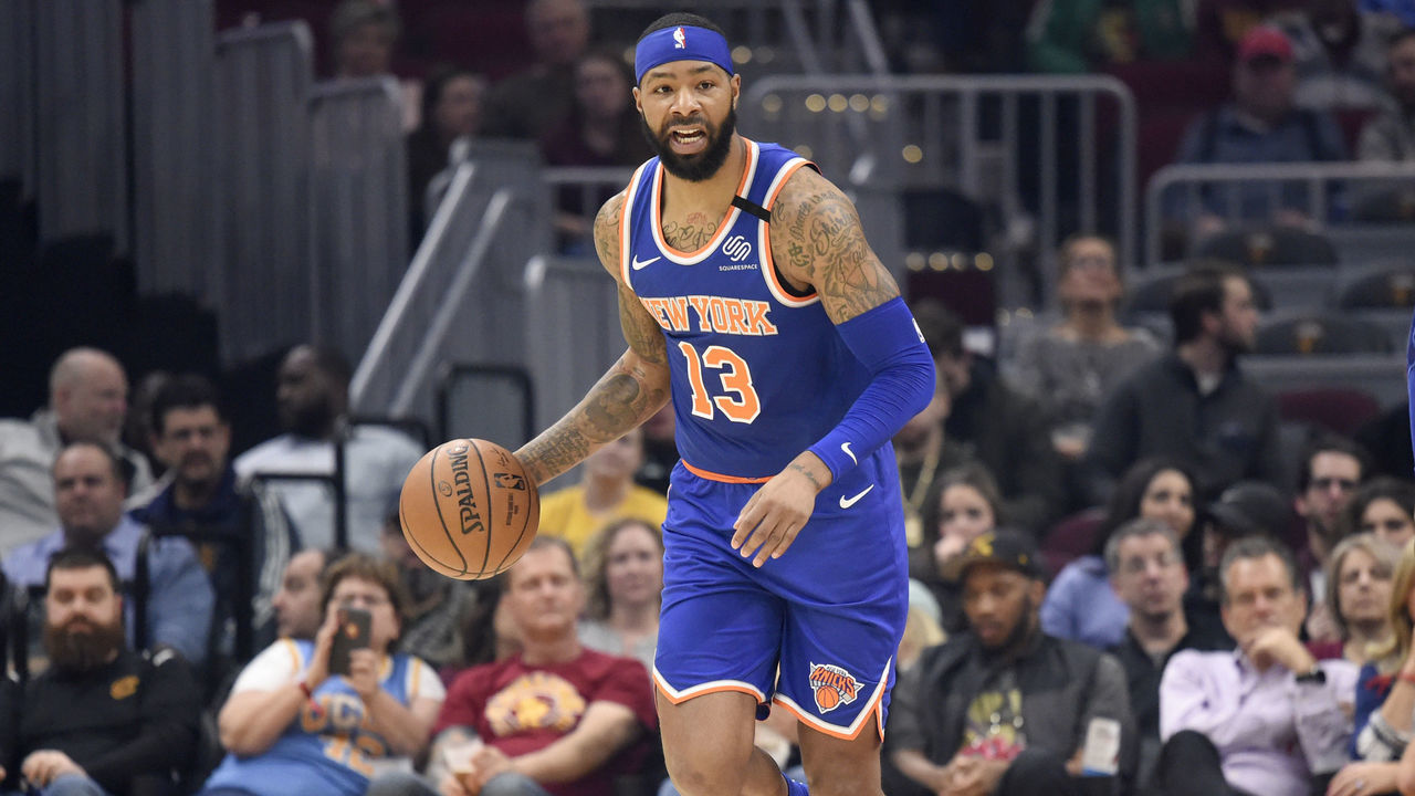 CLEVELAND, OHIO - FEBRUARY 03: Marcus Morris Sr. #13 of the New York Knicks drives down court as teammate Bobby Portis #1 gestures during the first half at Rocket Mortgage Fieldhouse on February 03, 2020 in Cleveland, Ohio. NOTE TO USER: User expressly acknowledges and agrees that, by downloading and/or using this photograph, user is consenting to the terms and conditions of the Getty Images License Agreement.
