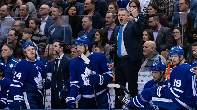 TORONTO, ON - FEBRUARY 03: Toronto Maple Leafs Head Coach Sheldon Keefe waves to a player to come off the ice during the third period of the NHL regular season game between the Florida Panthers and the Toronto Maple Leafs on February 3, 2020, at Scotiabank Arena in Toronto, ON, Canada.