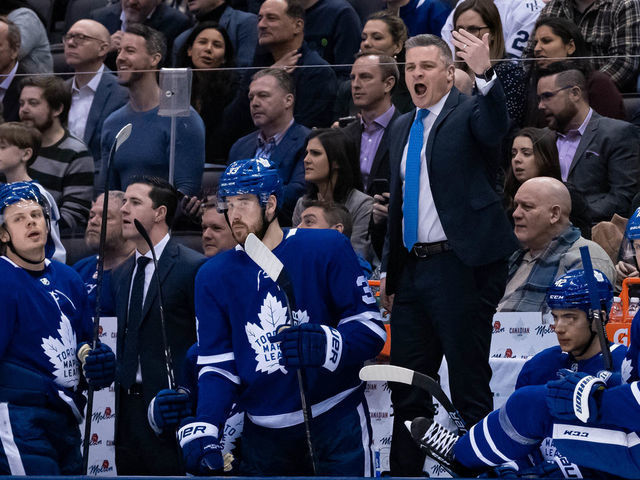TORONTO, ON - FEBRUARY 03: Toronto Maple Leafs Head Coach Sheldon Keefe waves to a player to come off the ice during the third period of the NHL regular season game between the Florida Panthers and the Toronto Maple Leafs on February 3, 2020, at Scotiabank Arena in Toronto, ON, Canada.